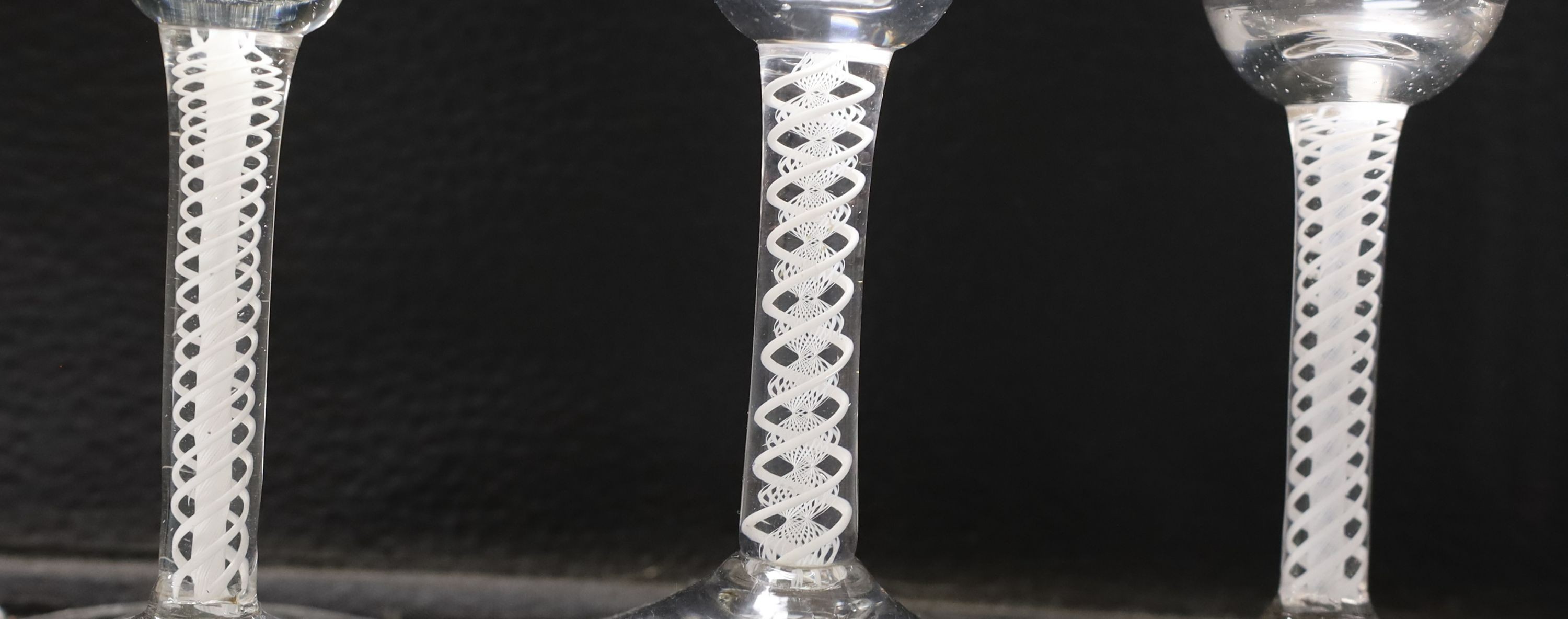 Three George lll opaque twist glasses, tallest 16cm, and two similar Dutch soda glasses